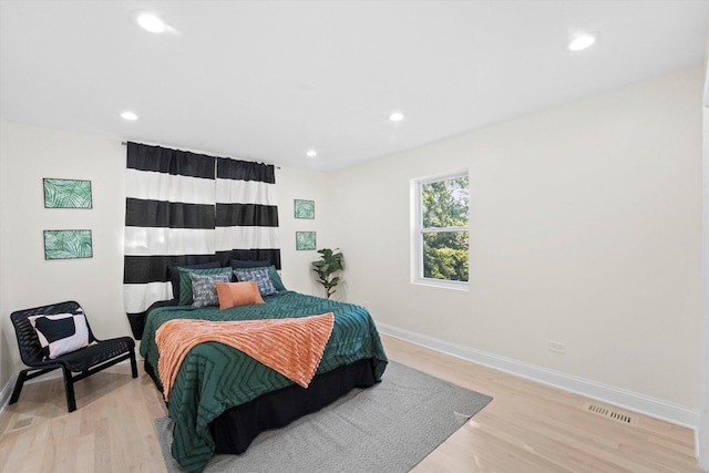 bedroom with light hardwood / wood-style floors