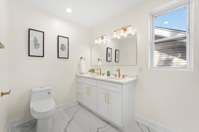 bathroom featuring toilet and vanity