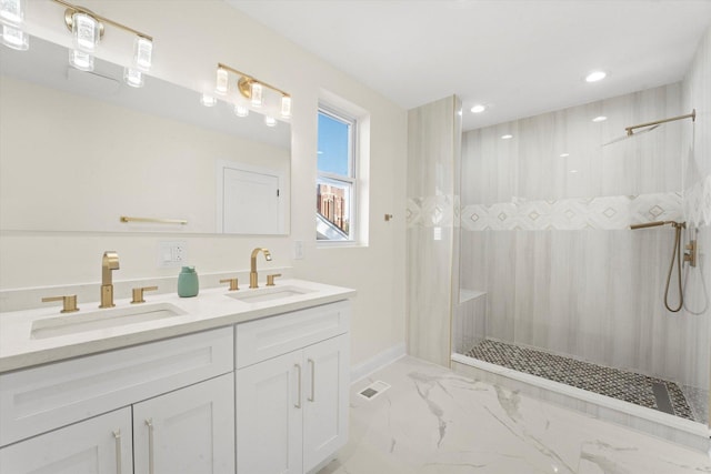 bathroom featuring vanity and tiled shower