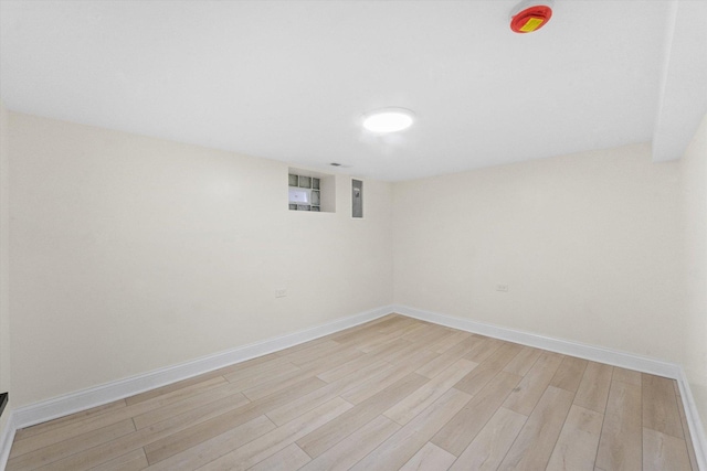 basement featuring light wood-type flooring