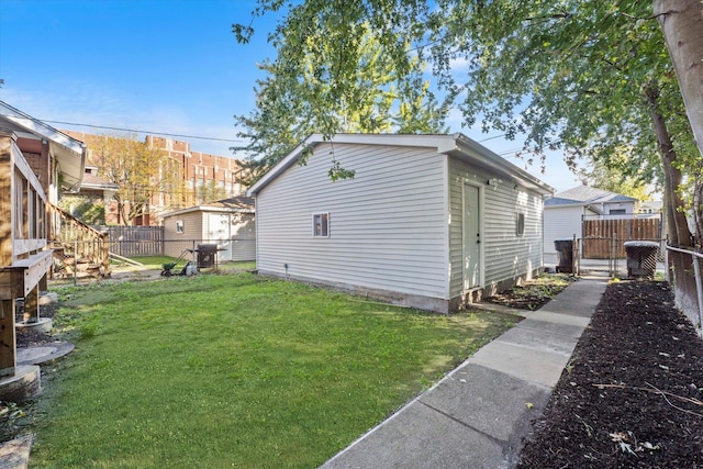 view of side of home with a yard