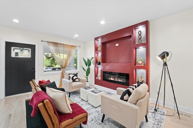 living room with light hardwood / wood-style flooring