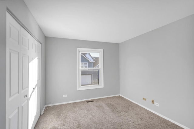 empty room featuring carpet floors