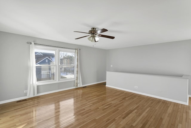 interior space with ceiling fan and hardwood / wood-style floors