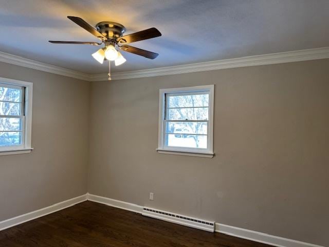 empty room with dark wood-type flooring, a baseboard radiator, crown molding, and ceiling fan