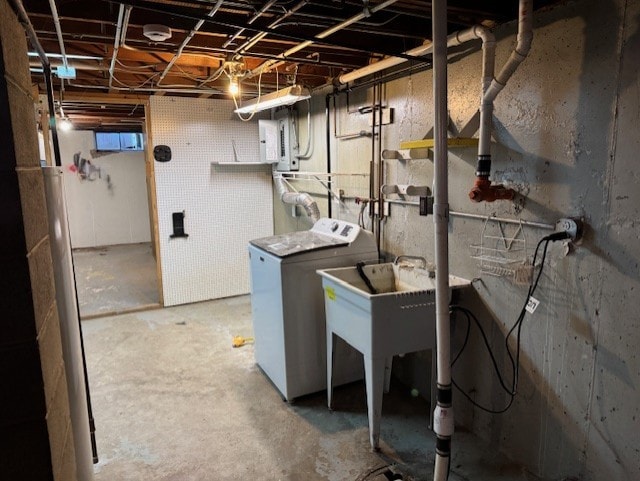 basement featuring washer / clothes dryer and electric panel