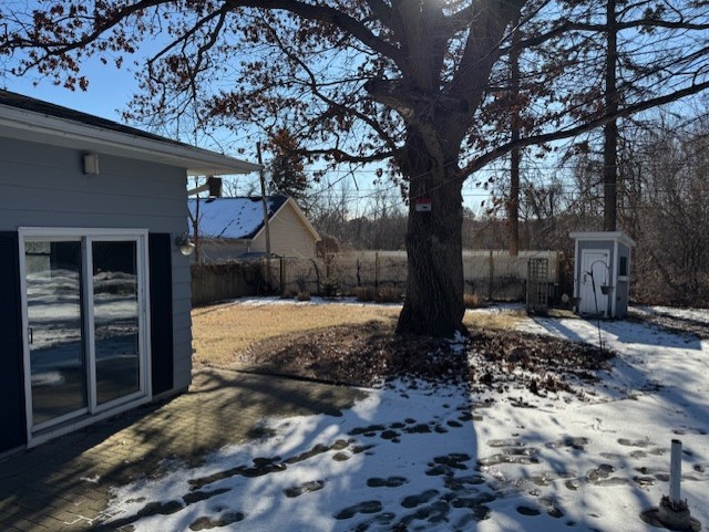 view of yard covered in snow