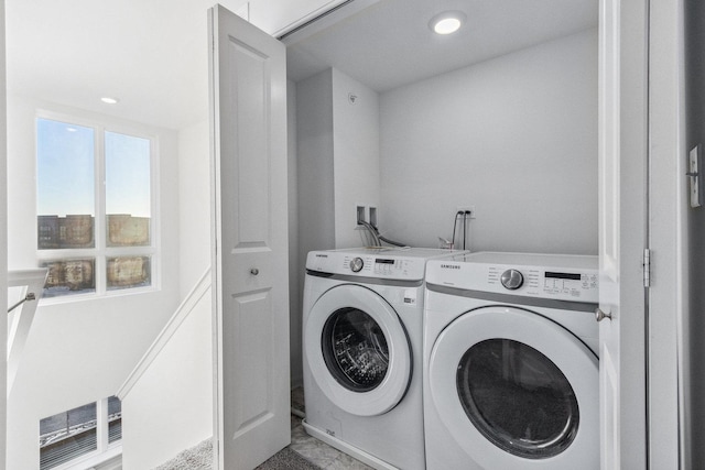 laundry room featuring washing machine and clothes dryer