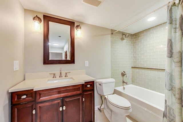 full bathroom featuring toilet, vanity, and shower / bath combo