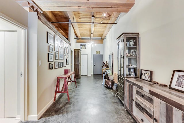 hallway featuring beam ceiling and wood ceiling