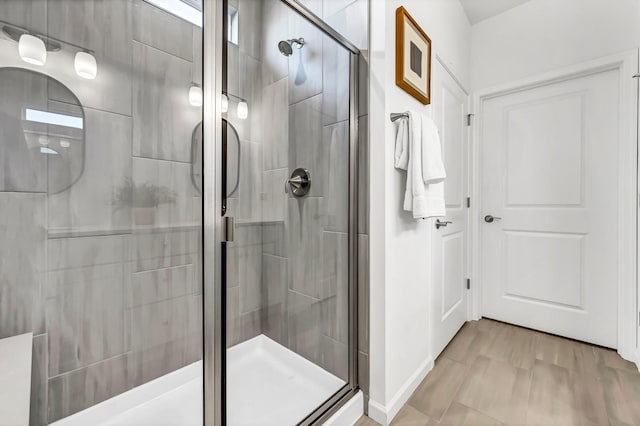 bathroom featuring an enclosed shower