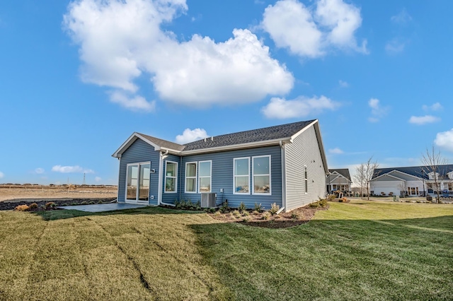 exterior space featuring a yard and central AC unit