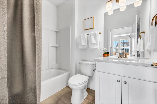 full bathroom with shower / bath combo with shower curtain, hardwood / wood-style flooring, toilet, and vanity