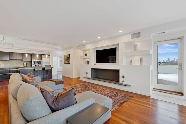 living room with light hardwood / wood-style flooring