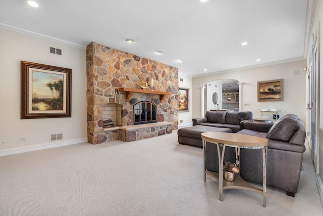 carpeted living room featuring crown molding and a fireplace