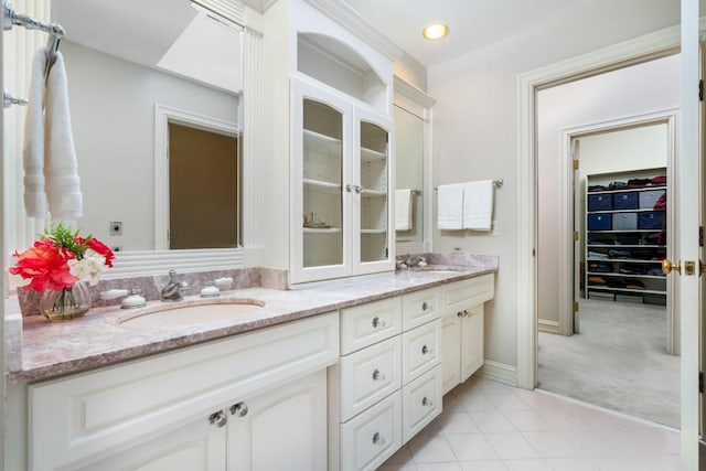 bathroom with vanity and tile patterned flooring