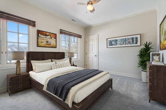 bedroom featuring ceiling fan, crown molding, and light carpet