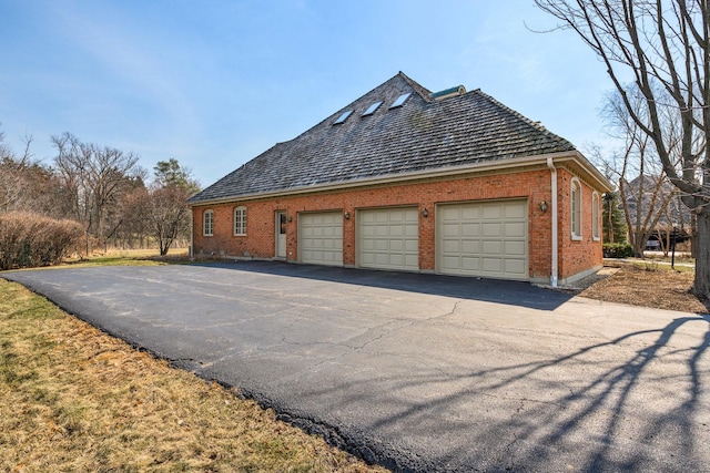 view of property exterior featuring a garage