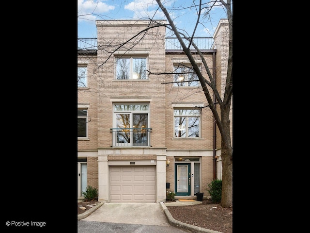 townhome / multi-family property featuring a garage