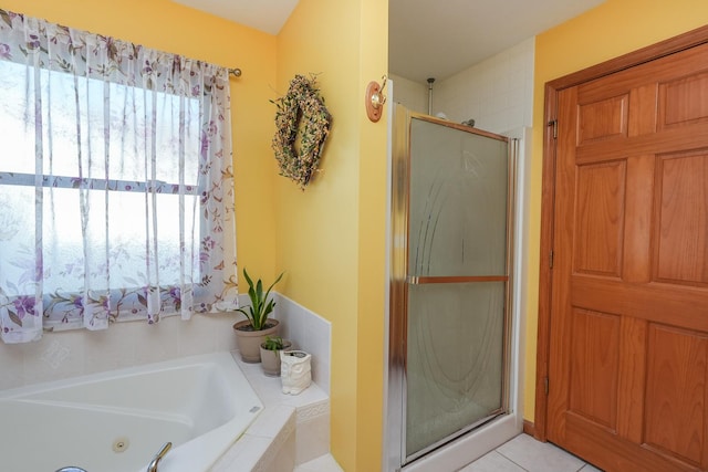 bathroom with tile patterned flooring and plus walk in shower