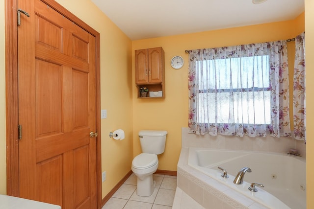 bathroom with tiled bath, toilet, and tile patterned floors