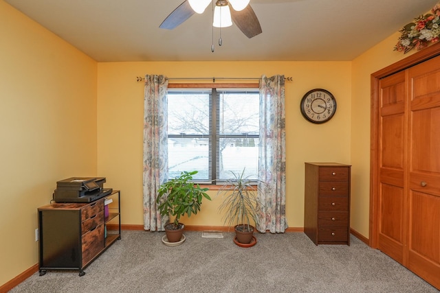 miscellaneous room featuring light carpet and ceiling fan