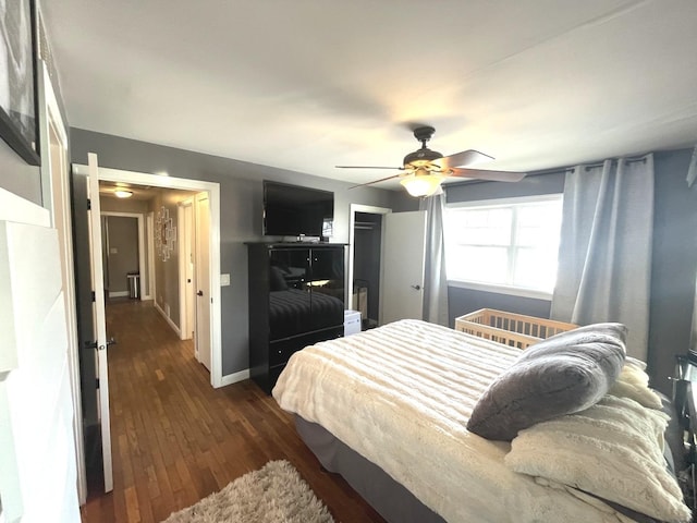 bedroom featuring ceiling fan and dark hardwood / wood-style flooring