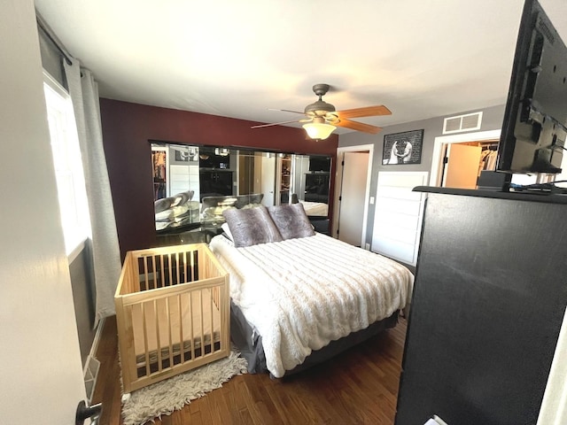 bedroom featuring hardwood / wood-style floors and ceiling fan