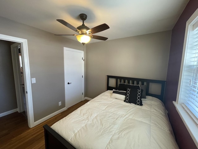 bedroom featuring hardwood / wood-style flooring and ceiling fan