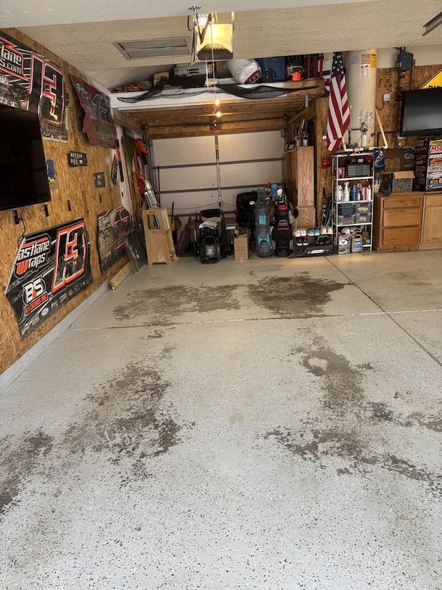 garage featuring gas water heater