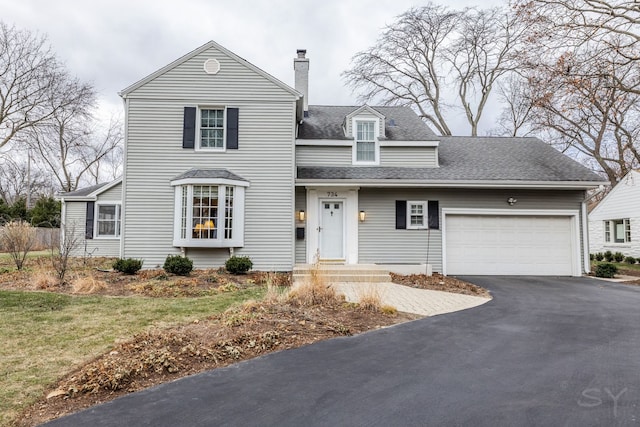 view of front facade with a garage and a front yard