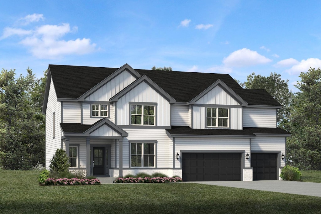 view of front of house featuring a front yard and a garage