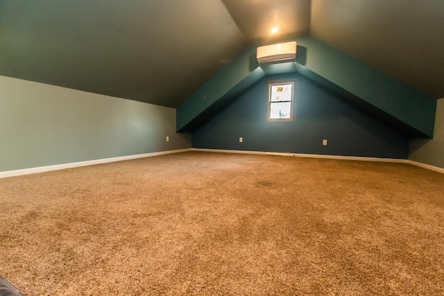 additional living space with lofted ceiling, carpet floors, and a wall unit AC