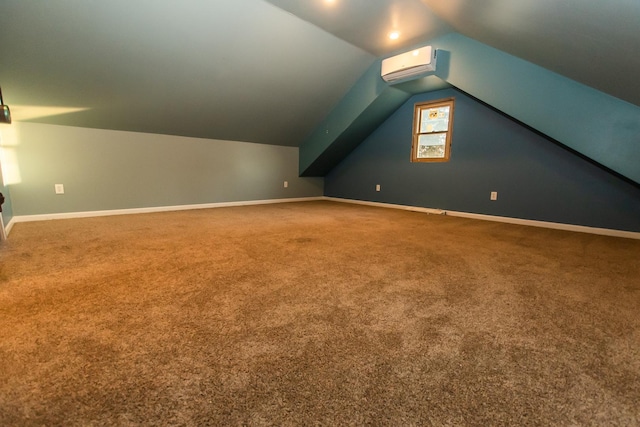 additional living space with carpet flooring, a wall mounted AC, and vaulted ceiling