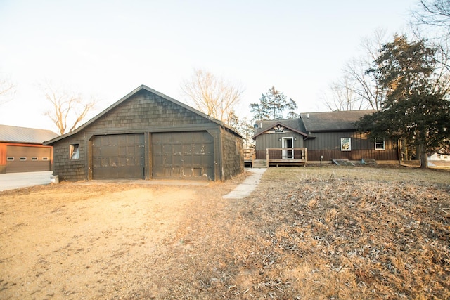 view of front facade featuring a garage and a deck