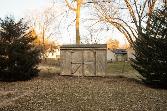 view of outbuilding with a lawn