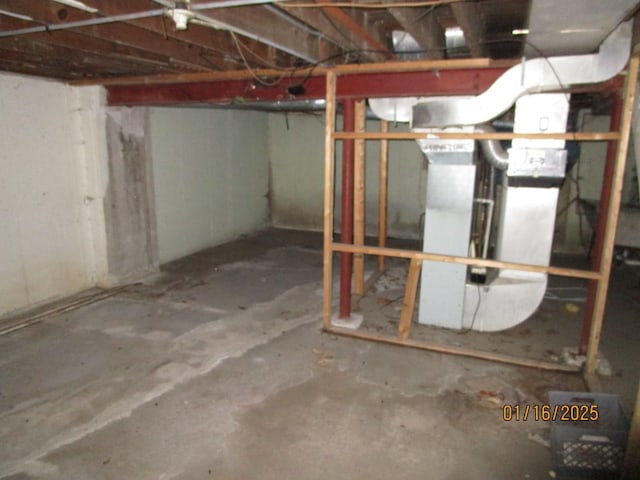 basement featuring heating unit