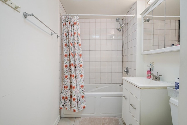 full bathroom with toilet, vanity, tile patterned flooring, and shower / bath combo with shower curtain