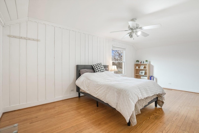 bedroom with ceiling fan and wood-type flooring