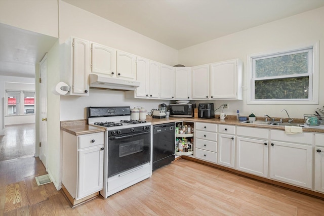 kitchen with white cabinets, black dishwasher, sink, and white gas range