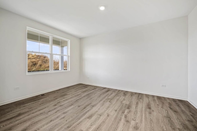 spare room with light wood-type flooring