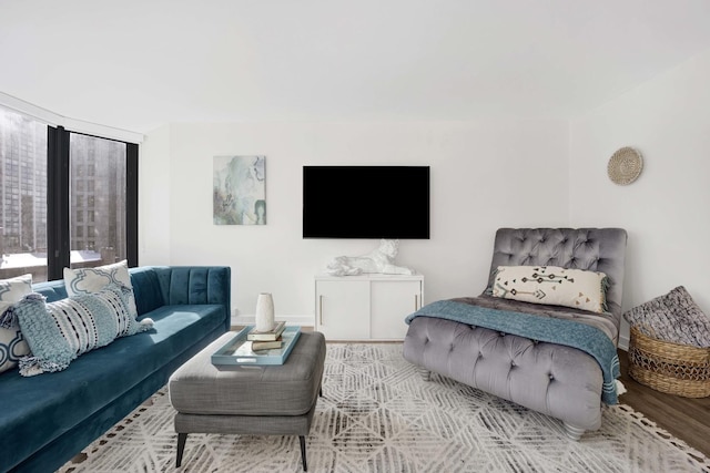 living room with light wood-type flooring and baseboards