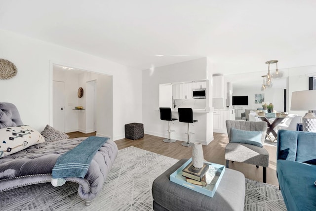 bedroom with baseboards and light wood-style floors