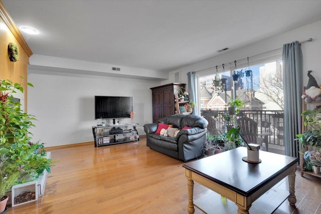 living room with light hardwood / wood-style flooring