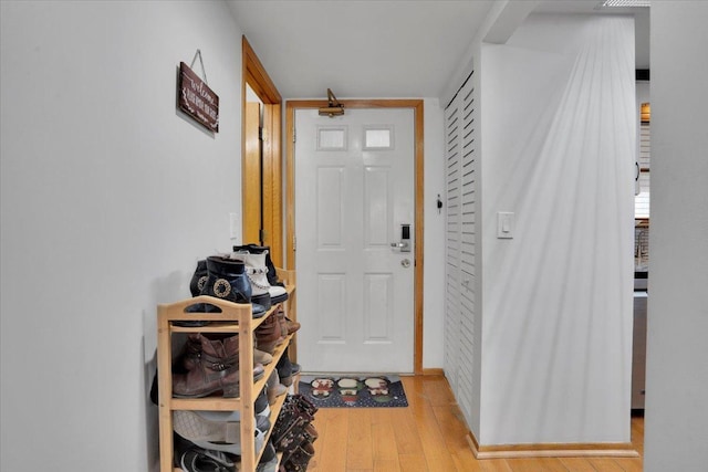 entryway with light hardwood / wood-style floors