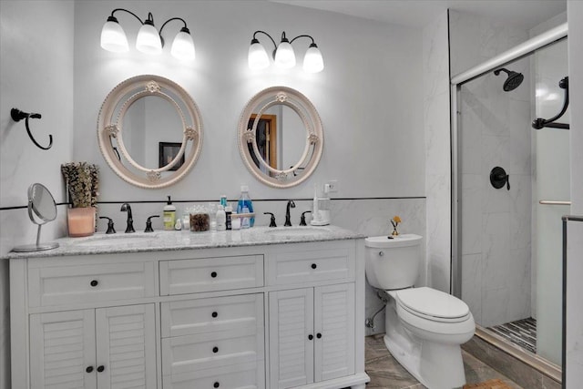 bathroom with toilet, walk in shower, and vanity