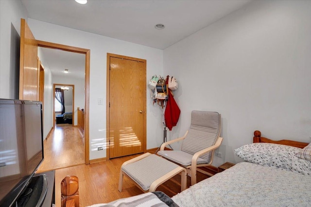 bedroom with light hardwood / wood-style flooring