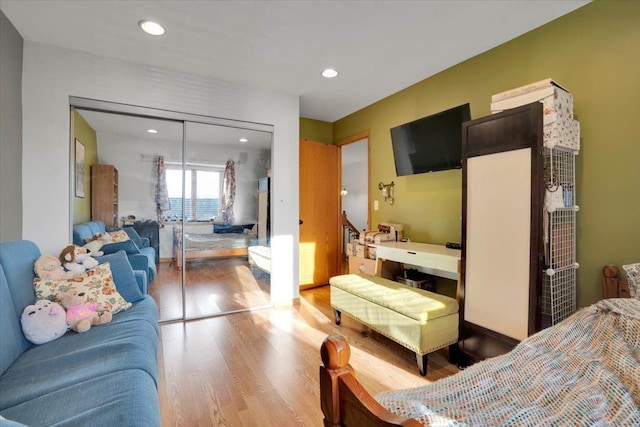 bedroom featuring hardwood / wood-style floors and a closet