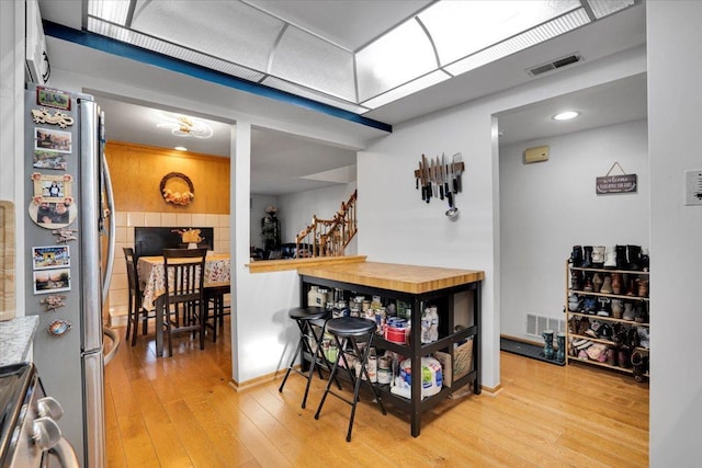 dining area featuring light wood-type flooring