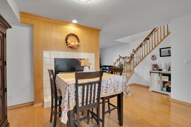 dining room featuring hardwood / wood-style flooring and ornamental molding